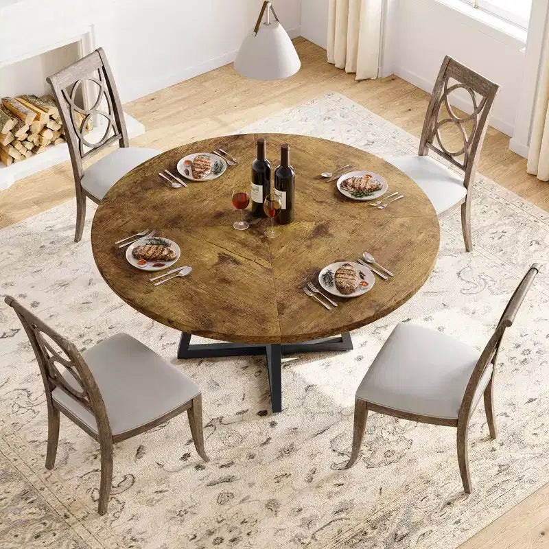 Tavolo da pranzo rotondo grigio per 4 persone, piano in MDF da 119 cm con base a croce in metallo nero