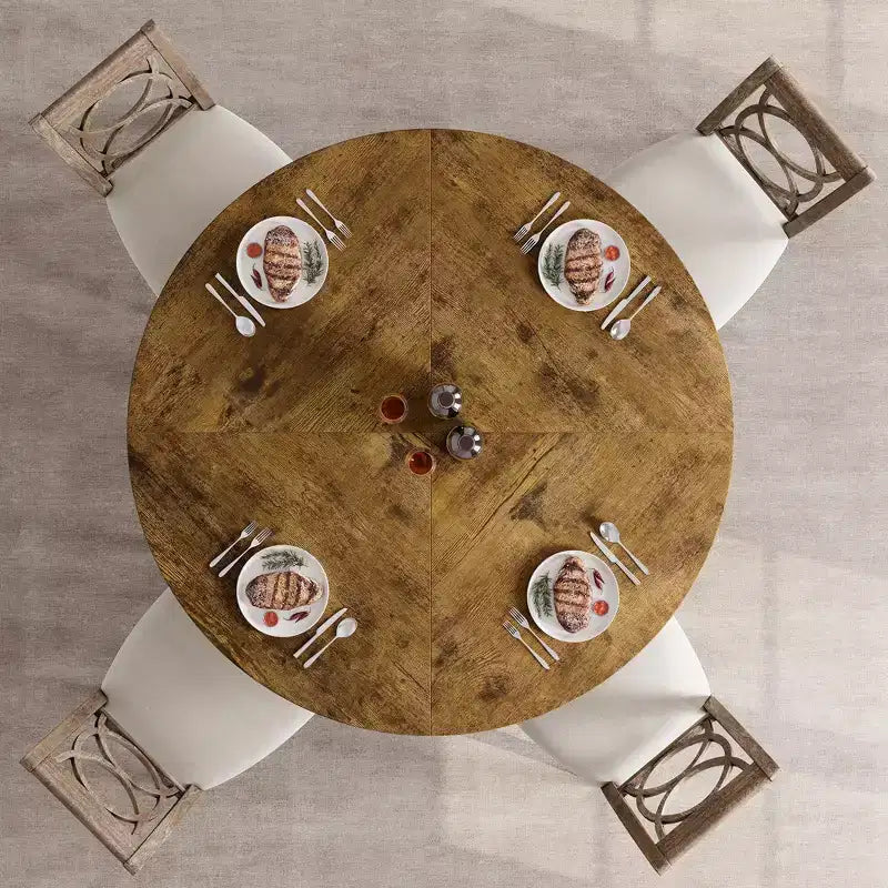 Tavolo da pranzo rotondo grigio per 4 persone, piano in MDF da 119 cm con base a croce in metallo nero