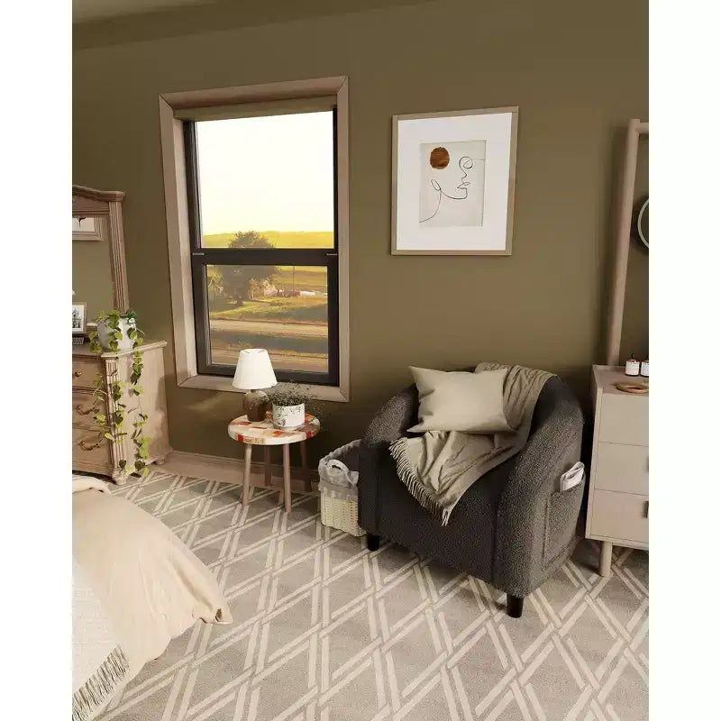 Poltrona a barilotto in tessuto bouclé nei colori nero/grigio scuro/bianco/giallo, con seduta singola